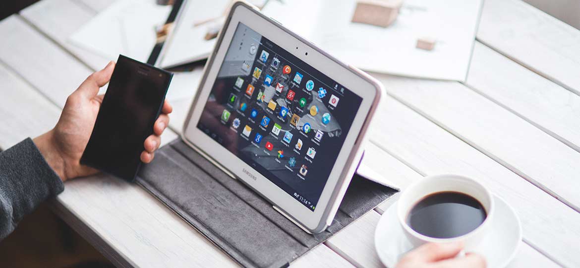 Person Drinking Coffee and Working Person Drinking Coffee and Working