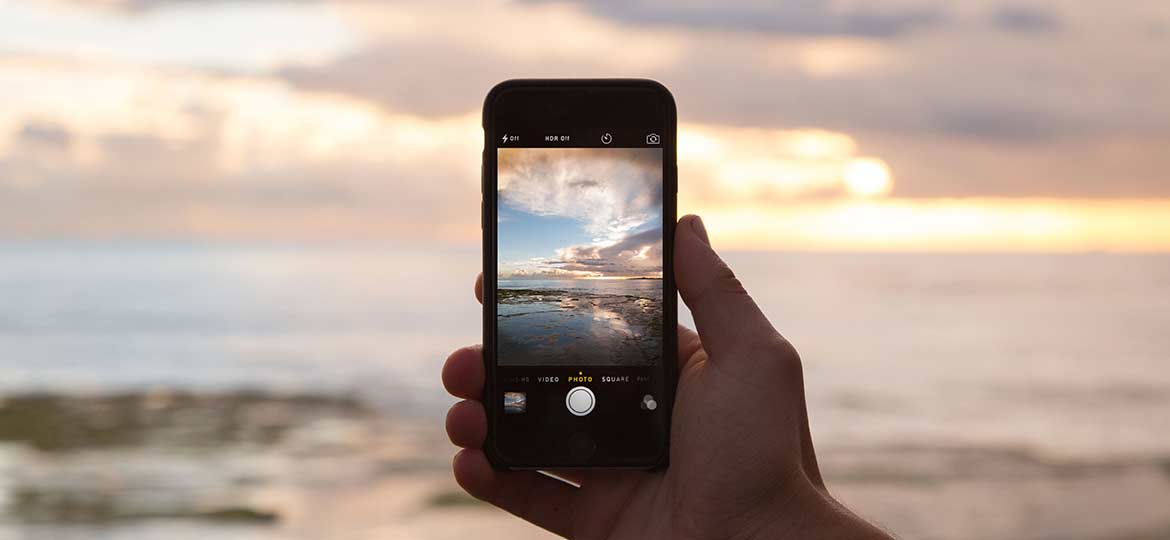 Person Holding Smartphone Person Holding Smartphone